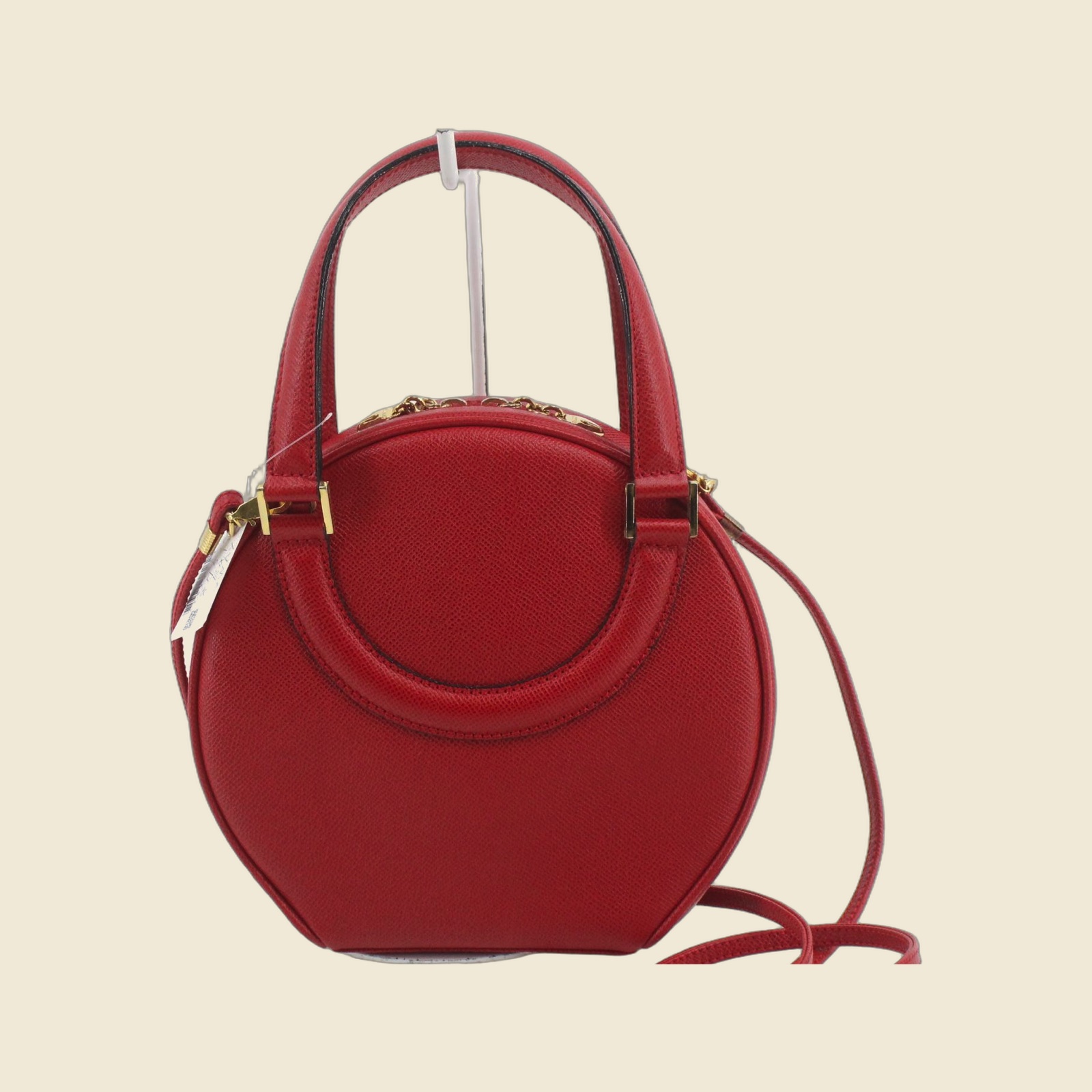 Borsa a mano Bally tonda in pelle granulata rossa con ferramenta dorata, doppio manico e tracolla, vista frontale