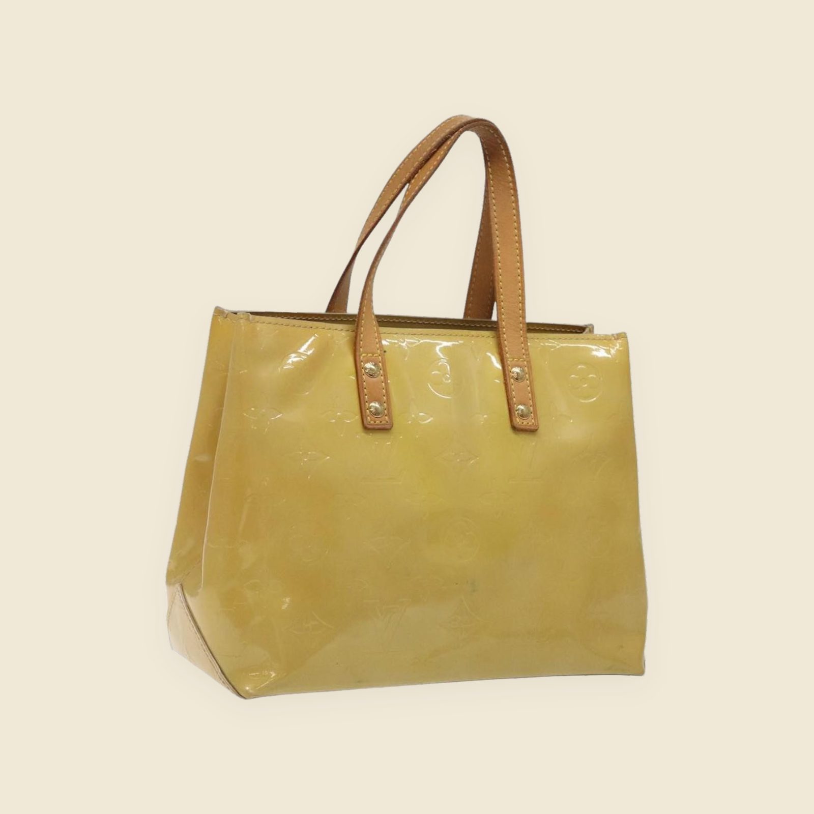 Borsa a mano Louis Vuitton in pelle verniciata gialla con Monogram impresso e doppio manico, vista frontale