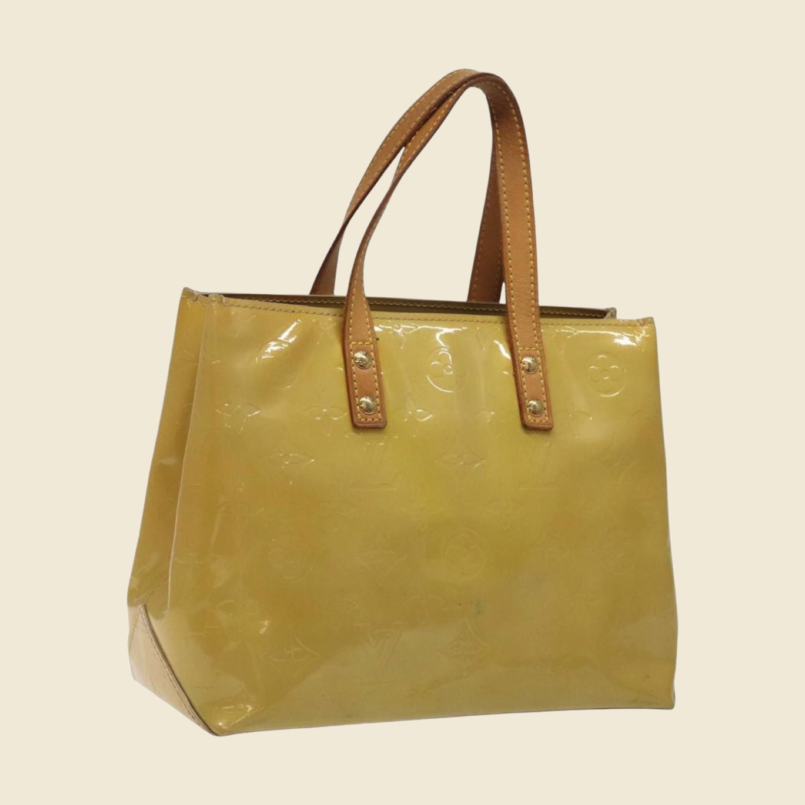 Borsa a mano Louis Vuitton in pelle verniciata giallo chiaro con monogramma impresso in rilievo e doppio manico, vista frontale